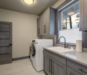 Grey themed laundry cabinet