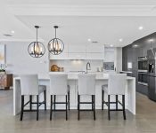 White kitchen with hanging lights