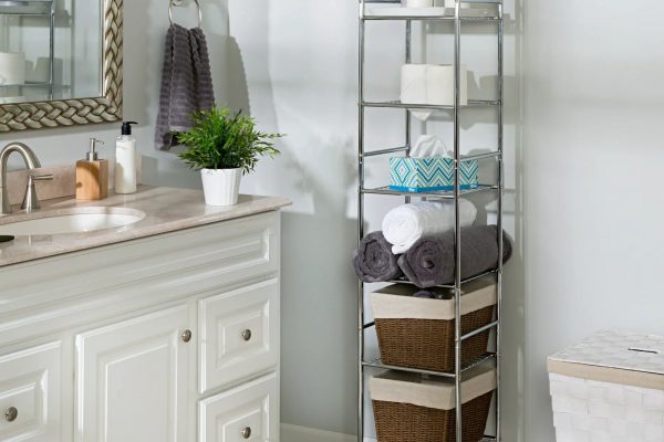 Shelving unit with clean towels in bathroom interior